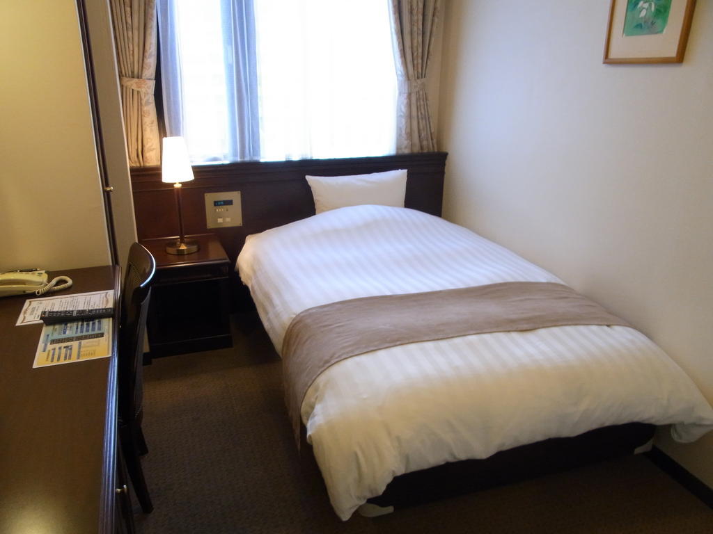 Amami Sunplaza Hotel Стая снимка